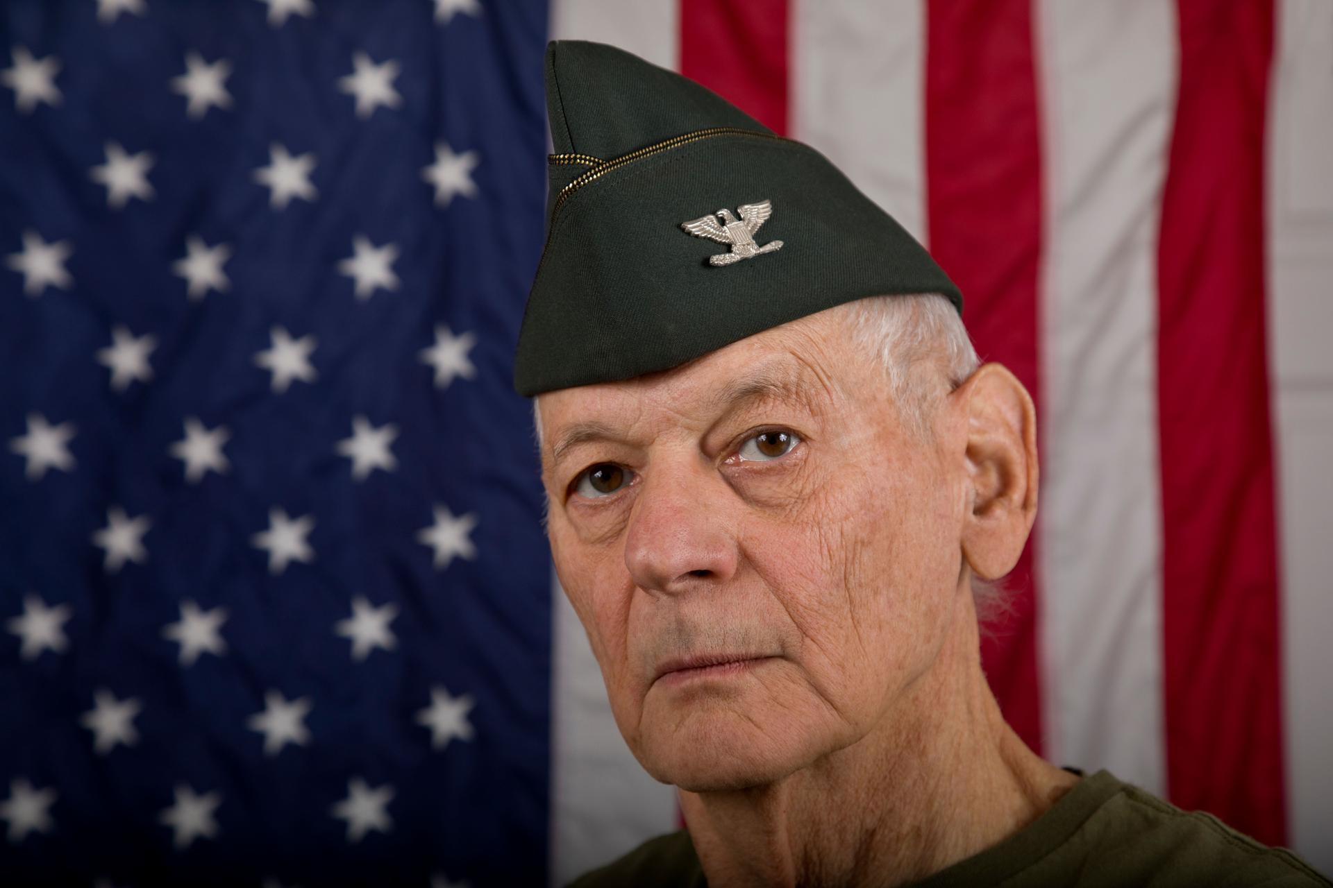Retired U.S. Army Officer wearing garrison cap with Colonel Insignia